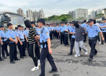 Macau police repatriate 36 money exchange gang members to the mainland